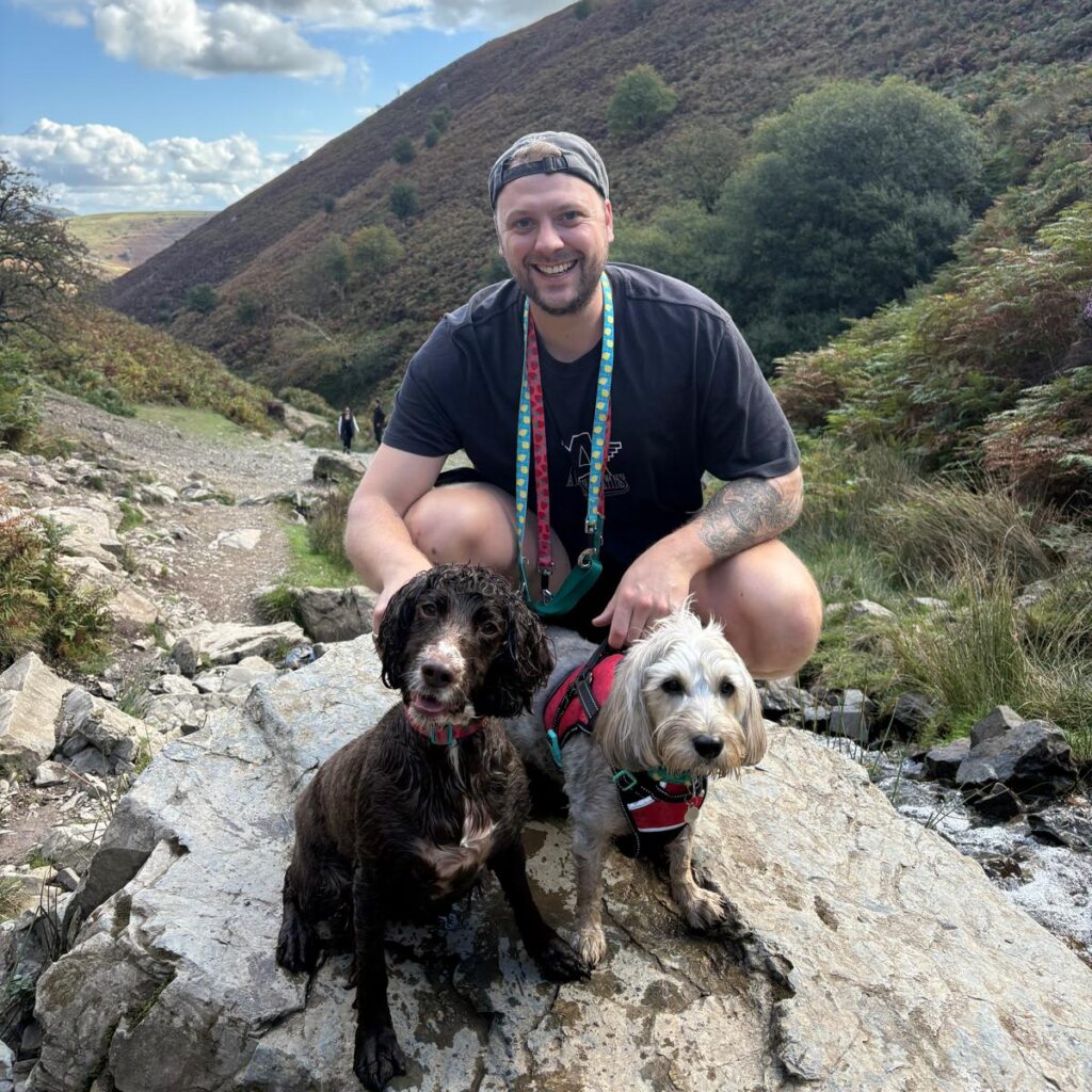 CoffeyClub Founder, Josh Coffey, pictured alongside his dogs.